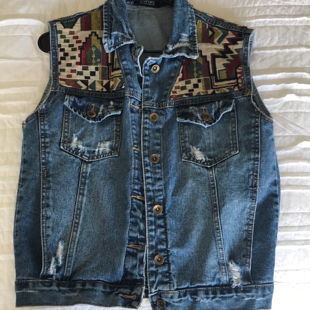 Distressed denim vest with tribal detailing